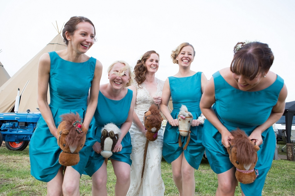 bridesmaids racing, quirky wedding photography, red bus hire wedding, katie byram photography, tipi wedding