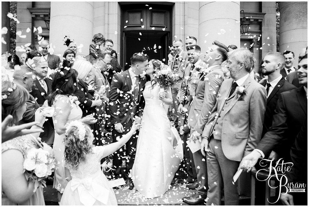 black and white confetti photo, the arches dean clough, yorkshire wedding venue, halifax wedding venue, saltaire wedding, saltaire church, yorkshire wedding photographer