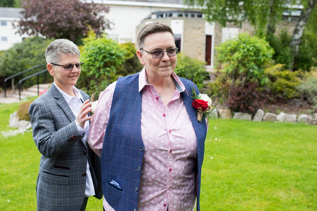 first look, two brides, brides in suits, Aviemore wedding